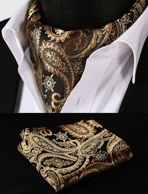 The Euro Tie is a middle ground between the necktie and the Ascot. Gold orange paisley silk cravat.