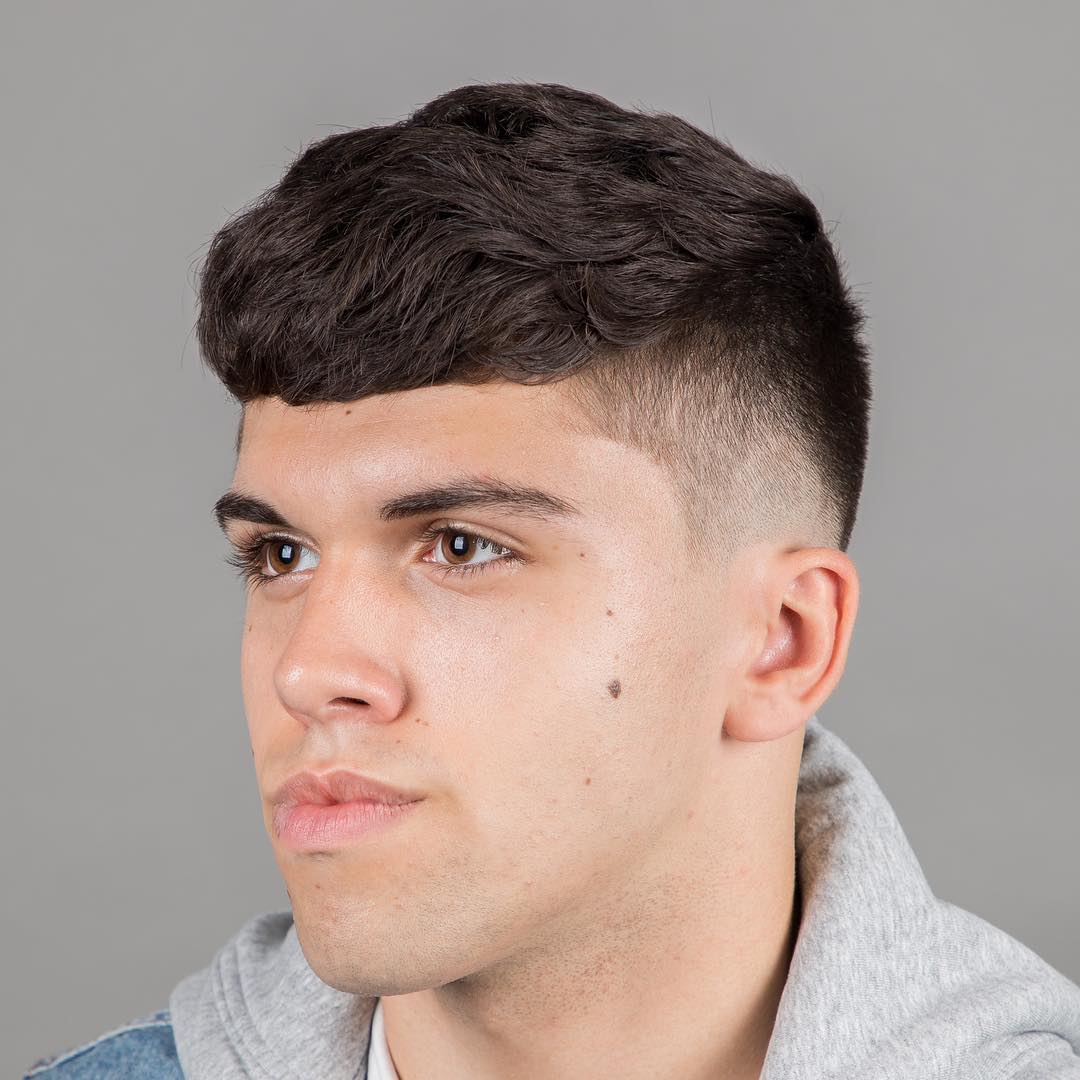 Wavy crop haircut for men with thick hair