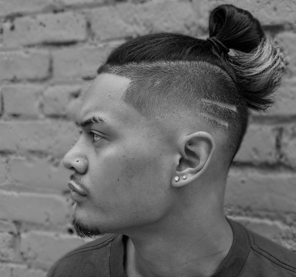 High fade with hair design and long hair on top